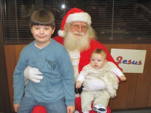 Baby Garrett with his older brother Adam sitting on Santa's lap
